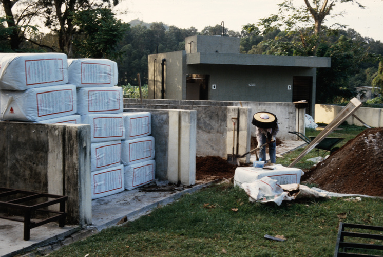 Hakka women making potting soil from compost, at the nursery in Shing Mun country park